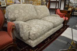 A good modern two seater settee with feather filled cushions.