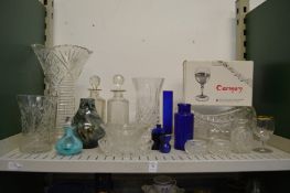 A shelf of cut glassware.