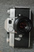 A Leicaflex camera and a Zenit 3M camera.