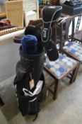 A set of ladies golf clubs with bag.