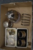 Silver pepper grinder, toast rack and other items.