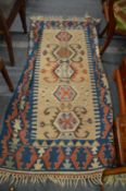 A Kilim rug 170cm x 110cm.