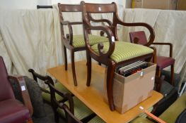 A set of six Regency style dining chairs, two with arms.