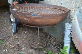 A wrought iron fire pit.