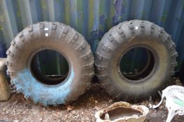 Two large tyres suitable as exercise equipment or exterior planters.