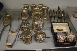 A collection of mixed silver items to include pedestal cups, pair of cased napkin rings, cream jug