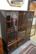 A good mahogany cupboard bookcase with three glazed doors on a base with three cupboard doors on