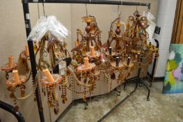 Four amber glass chandeliers.