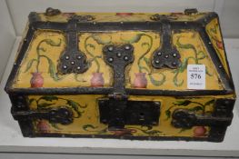 A decoratively painted wooden and wrought iron medieval style casket.
