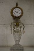 A cut glass and ormolu clock.