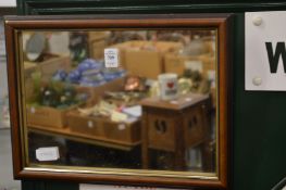 Two small modern mirrors.