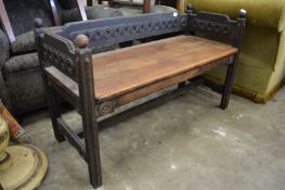 A small oak bench seat.