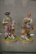 A pair of Dresden figures of a male and female gardener.