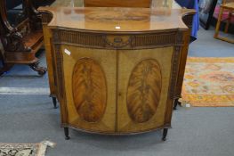 A good Hepplewhite style mahogany two door commode of bow fronted form with concave sides, carved