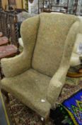 A Georgian style wing armchair.