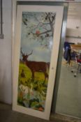 An unusual painted door decorated with a woodland scene.