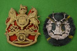 Two large military badges.