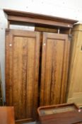 A Victorian pitch pine two door wardrobe.