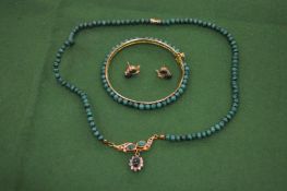 A suite of malachite jewellery.