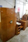 An Art Deco bedroom suite comprising two door wardrobe, pedestal dressing table with stool and
