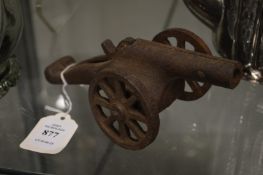 A small cast iron model cannon.