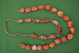 Two chunky bead necklaces.