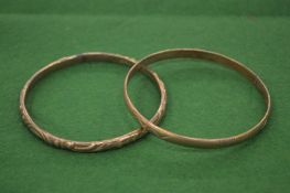 Two silver bangles.