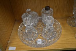 Cut glass circular dressing table tray with pair of candlesticks, perfume bottle and powder bowl and