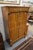 A 19th century French mahogany and ormolu mounted secretaire a abattant.