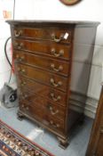 A good mahogany chest of seven graduated long drawers on carved bracket feet (on-suite to lot 369).