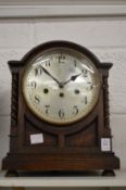 An oak cased mantle clock.