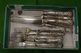 A set of six silver handled fruit knives and forks.