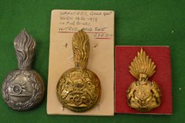 Various cap or helmet badges.