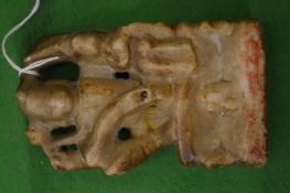 An early Islamic carved soapstone figure of a deity.