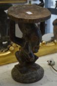 An African carved wood figural stool, Congo region.