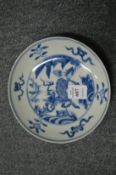 A Chinese blue and white saucer.