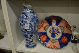 A Chinese blue and white baluster shaped vase (neck damaged), and an Imari plate.