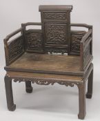 AN IMPRESSIVE 18TH CENTURY CHINESE HARDWOOD THRONE CHAIR, possibly zitan, the back and arms with ca