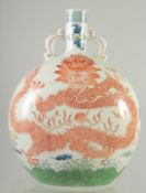 A CHINESE CORAL RED AND WHITE PORCELAIN MOON FLASK, painted with large central dragon and flaming