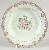 A CHINESE FAMILLE ROSE PORCELAIN DISH, (af), 22.5cm diameter.