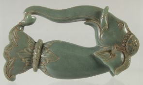 AN INDIAN ELEPHANT FORMED HARDSTONE DAGGER HANDLE, (af - pieces included), 14.5cm long.