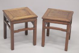 A PAIR OF CHINESE HARDWOOD SQUARE-FORM STANDS, 48cm high.