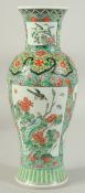 A CHINESE FAMILLE VERTE PORCELAIN VASE, painted with panels of flora, 30cm high.
