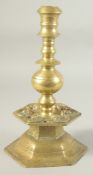 AN UNUSUAL 18TH-19TH CENTURY POSSIBLY OTTOMAN ARMINIAN BRASS CANDLESTICK, depicting angels around
