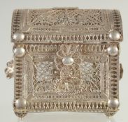 A SMALL FILIGREE BOX, with hinged lid, 7.5cm wide, 8cm high.