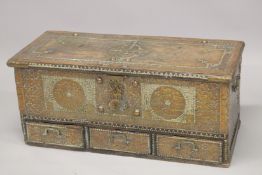 A MOORISH COFFER, with brass studded decoration, rising top, and candle box to the interior, the