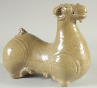 A LARGE GLAZED POTTERY FIGURE OF A STYLISED RAM, 27cm long.