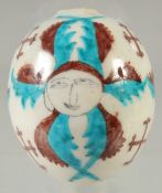 A TURKISH OTTOMAN ARMENIAN GLAZED POTTERY HANGING BALL ORNAMENT, 8cm high.