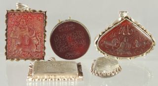 A FINE COLLECTION OF FIVE ISLAMIC SEALS, various stones, the two larger seals with lions and