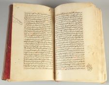 AN EARLY ISLAMIC LEATHER BOUND FIQH MANUSCRIPT ON JURISPRUDENCE, dated 969AH, 23cm x 14.5cm.
